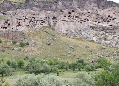 A whole city carved into the cliff.