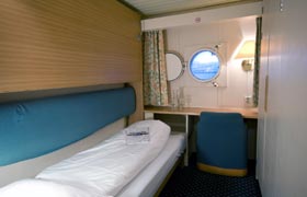 The backrest folds up and the second bed folds down to convert the seat into a set of bunk beds